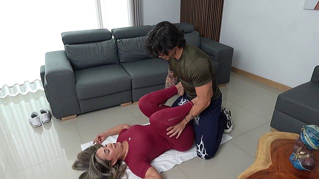 A gorgeous blonde MILF fucks her trainer, who&rsquo;s got a massive cock, with her tight pussy whilst her husband&rsquo;s away